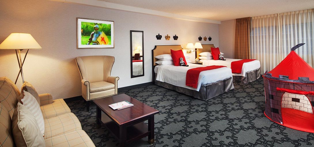 Whimsical enchanted suite with themed décor, two beds, and family-friendly space in Anaheim hotel rooms near Disneyland® Resort