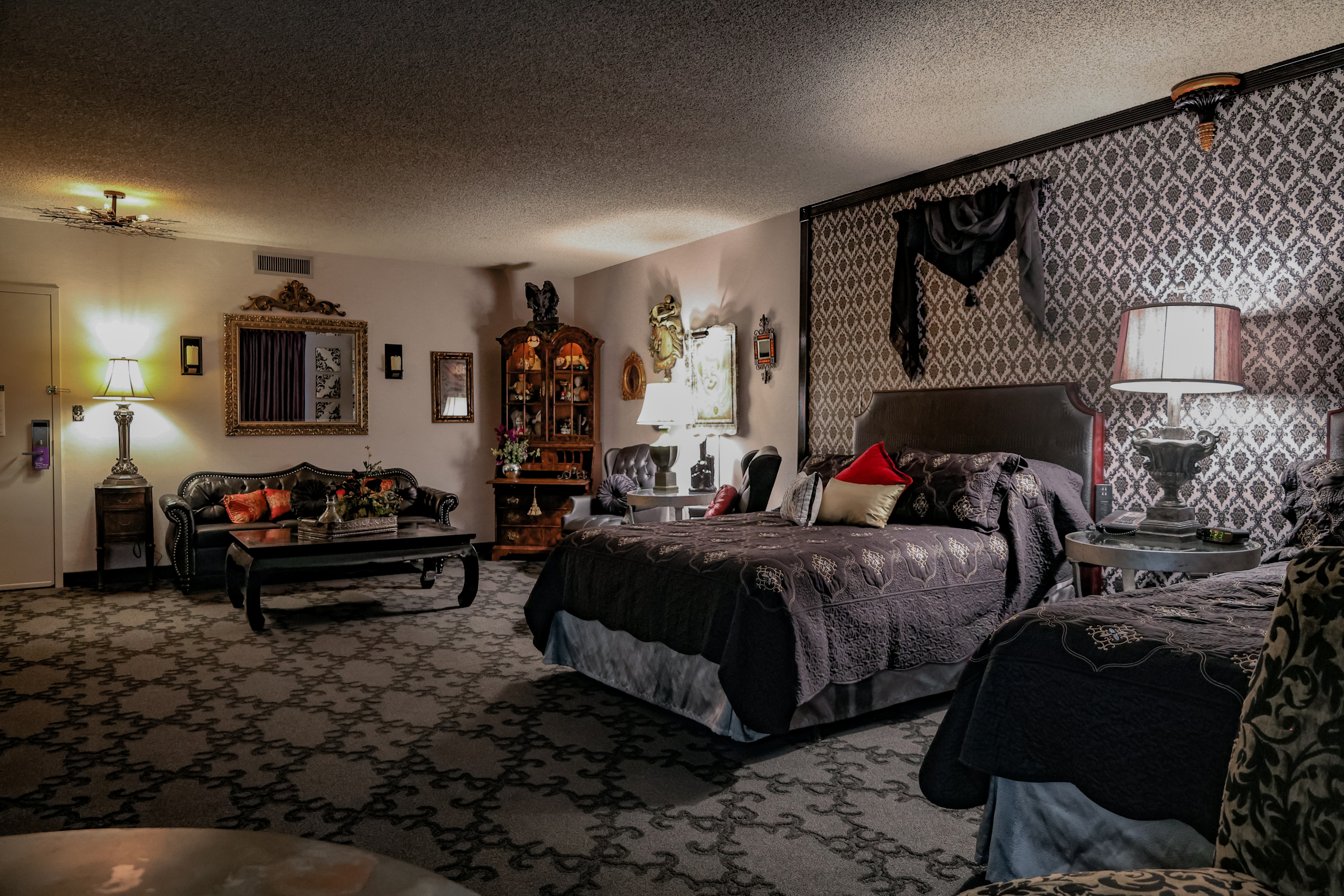 Immersive themed suite with unique décor, dramatic styling, and storytelling design.
